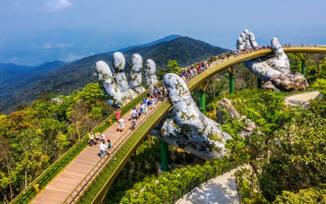 The Golden Bridge held by giant stone hands at Bà Nà Hills, Đà Nẵng, Vietnam